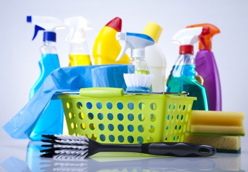 Professional oven cleaner in SW11 cleaning a kitchen oven interior