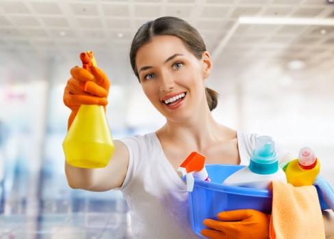 Cleaning professional in SW11 using safe working practices in a property